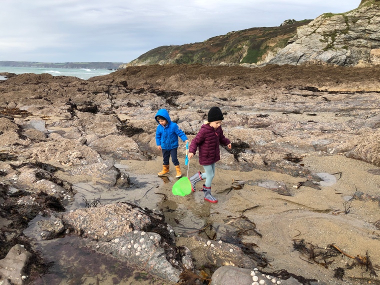 Cornwall with kids: Hemmick Beach - Bella and Reuben exploring rocky beach